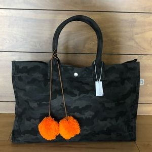 Elegant Black Camouflage Tote with Orange Pom-Poms